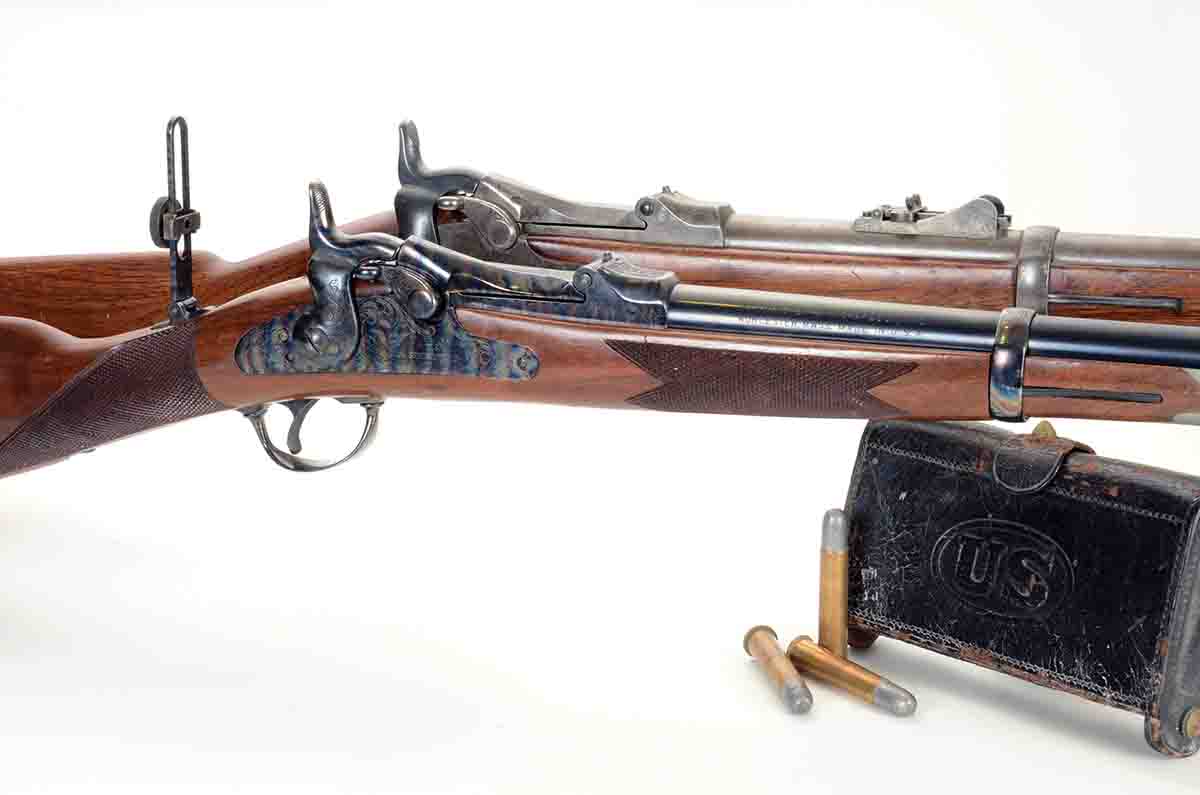 One of the front runners of the single-shot renaissance was the (front) Harrington & Richardson Model 1873 “Officer’s Model trapdoor” Springfield .45-70 shown here with an original Model 1873 carbine.